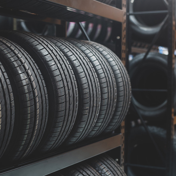 A new tire is placed on the tire storage rack in the tire factory