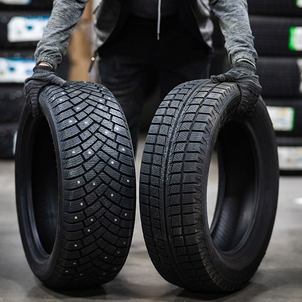 Mechanic keeps new summer and winter car tires in the garage