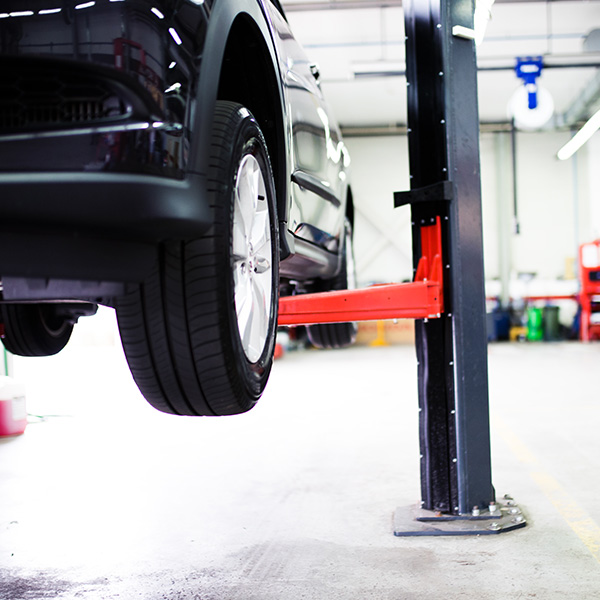 Car on lift at car service