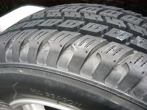 Close-up of all-season tire tread pattern