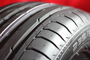 Close-up view of car tire tread pattern