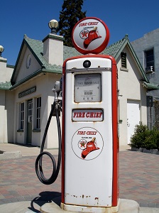 Vintage Fire Chief gas pump in front of a building